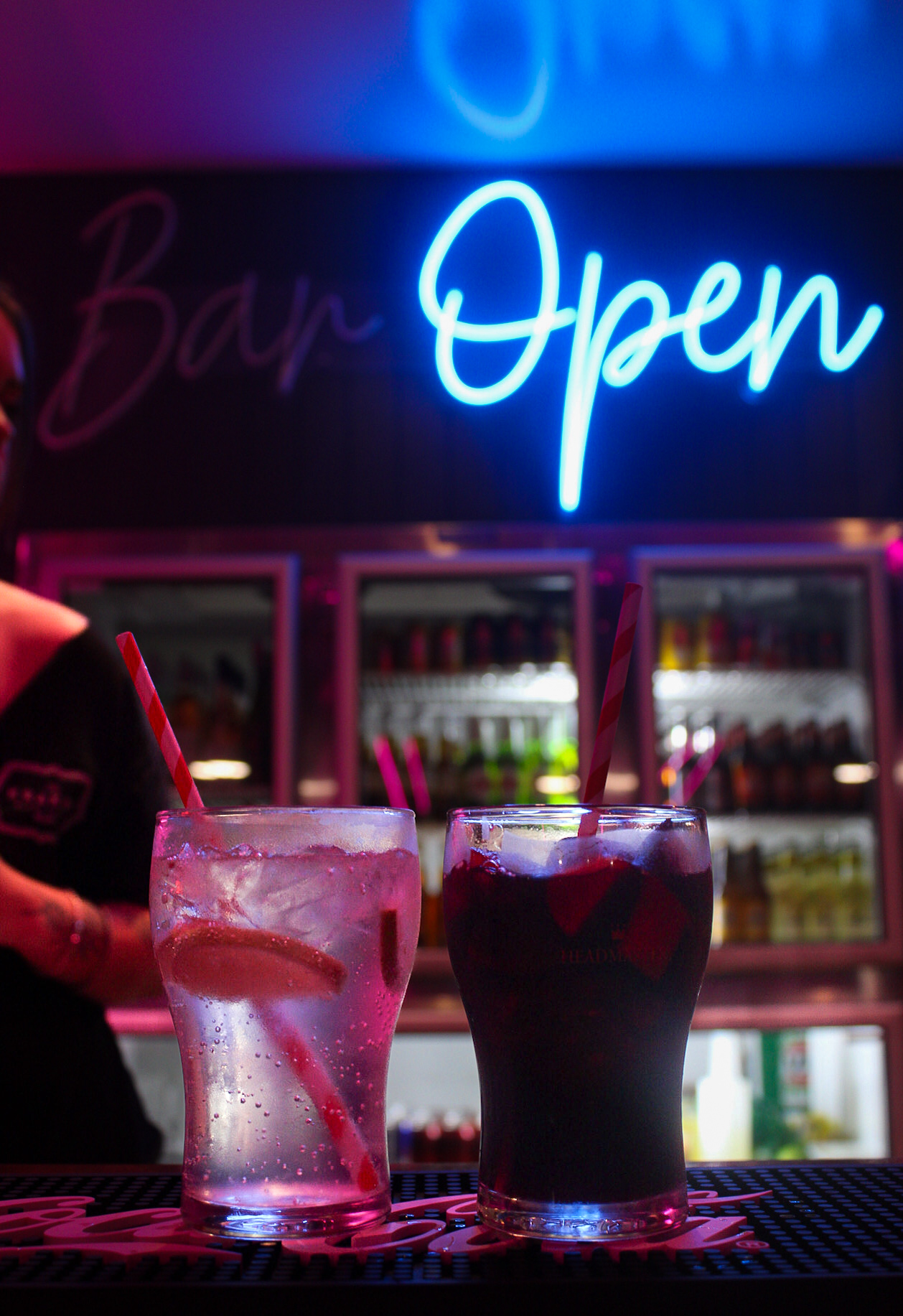 Bar counter lit in bright neon colors